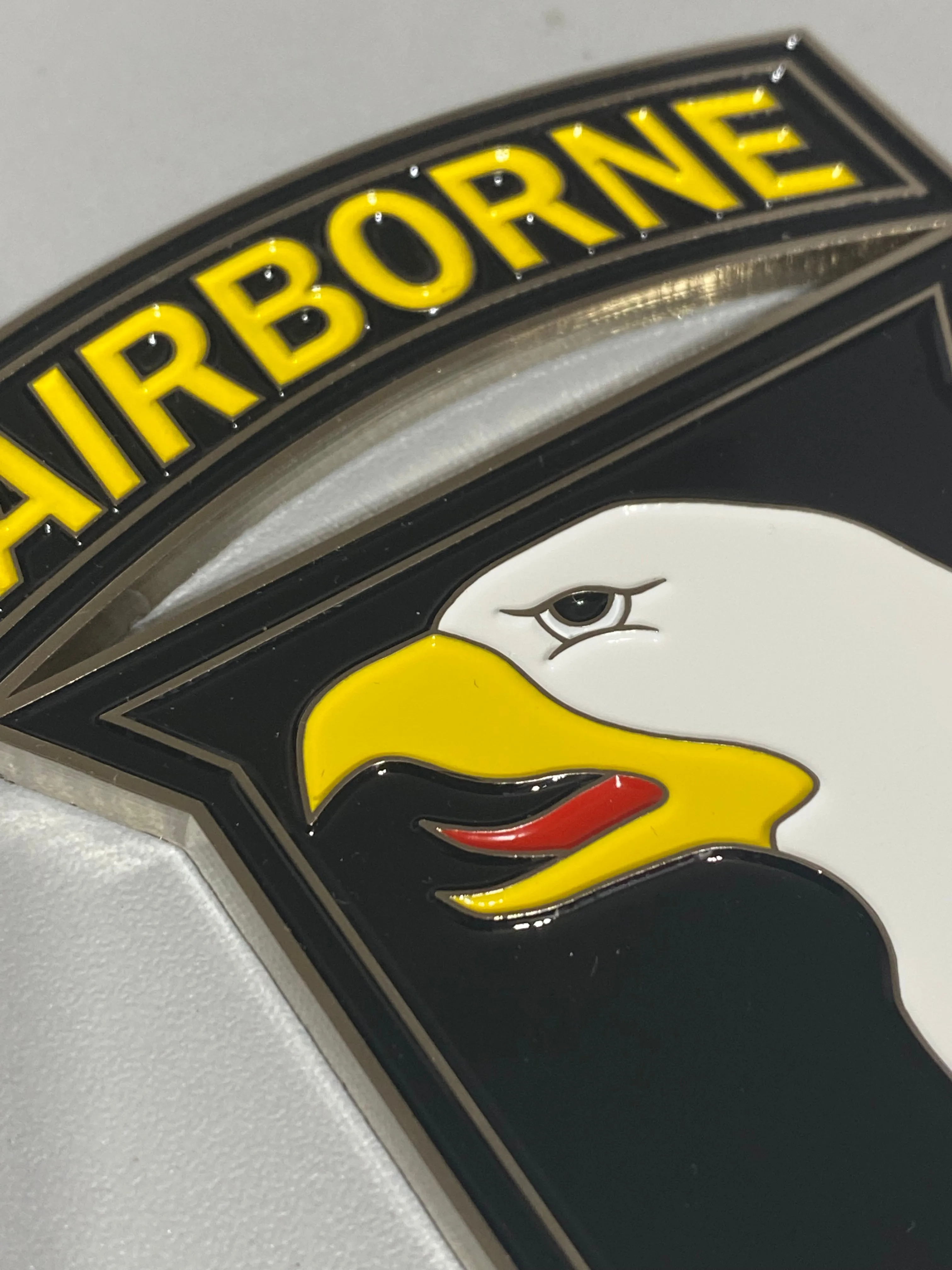 Metal 101st Airborne patch medallion with adhesive